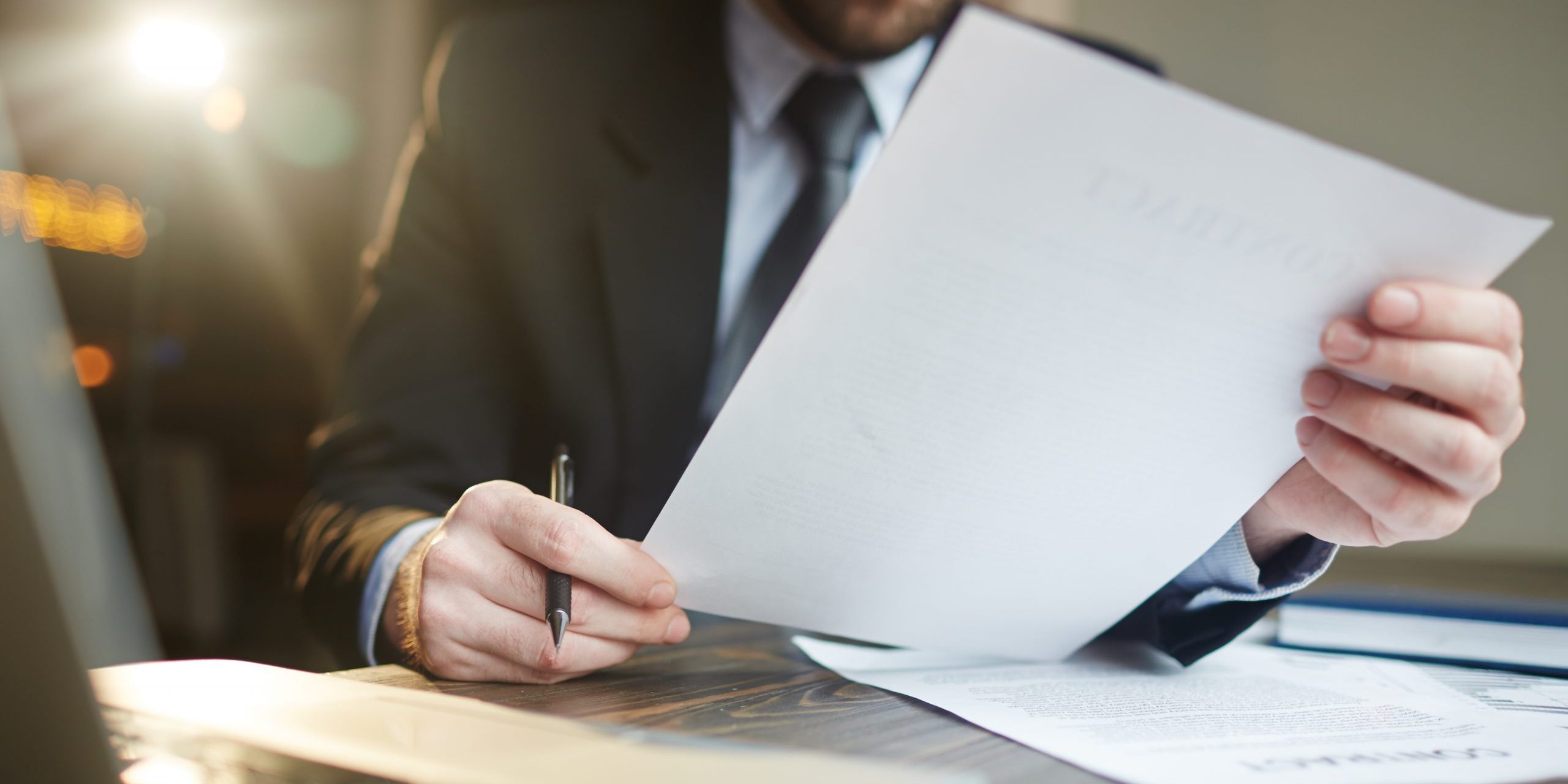 Businessman Working with Documentation at Desk