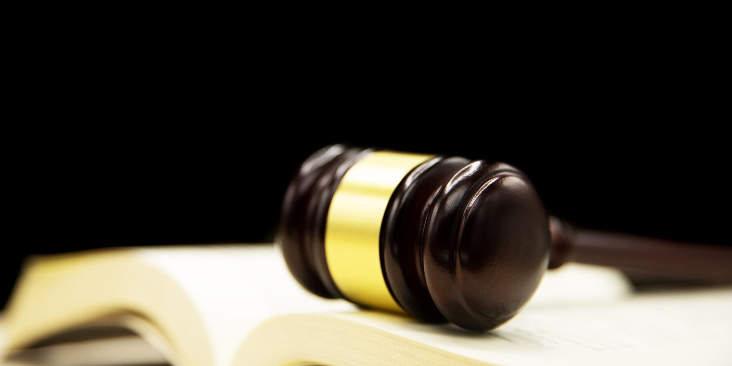 judges-gavel-on-book-and-wooden-table-law-and-justice-concept-background